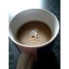 Another image with the drink of the substitute in a cup. The drink has the same texture as real coffee and forms bubbles in the same way.