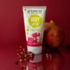 Body cream with organic pomegranate & organic rose Benecos 150ml in tube with pomegranate on the background