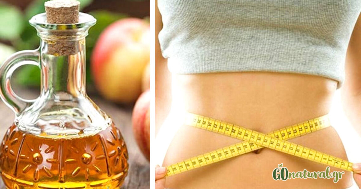 Apple cider vinegar in a glass bottle and next to a woman's waist and around it a measuring tape