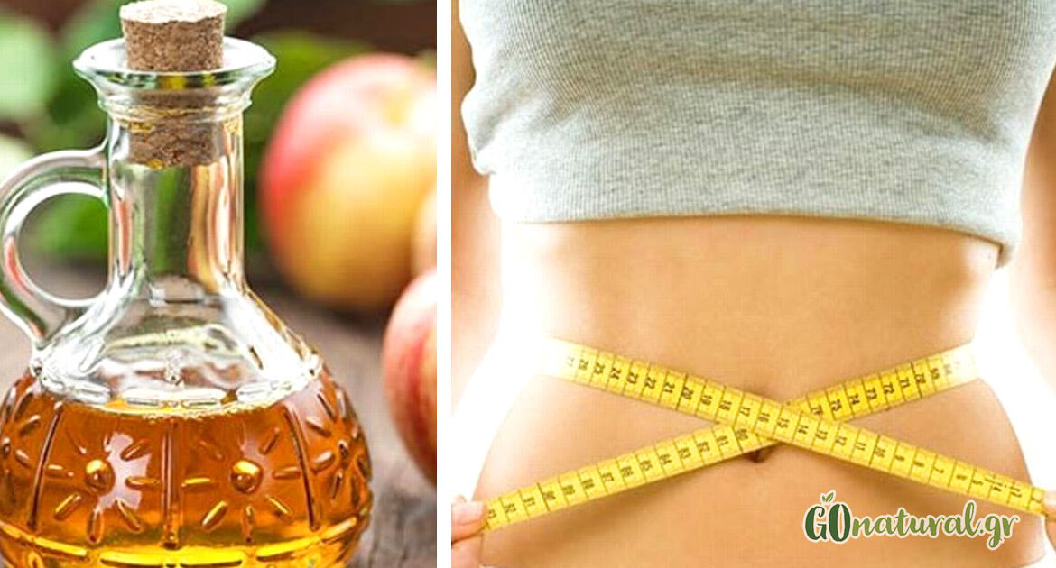 Apple cider vinegar in a glass bottle and next to a woman's waist and around it a measuring tape
